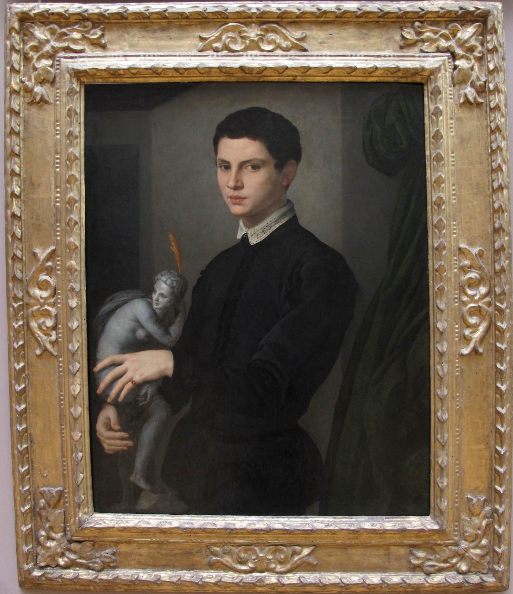 Portrait of a Man Holding a Statuette