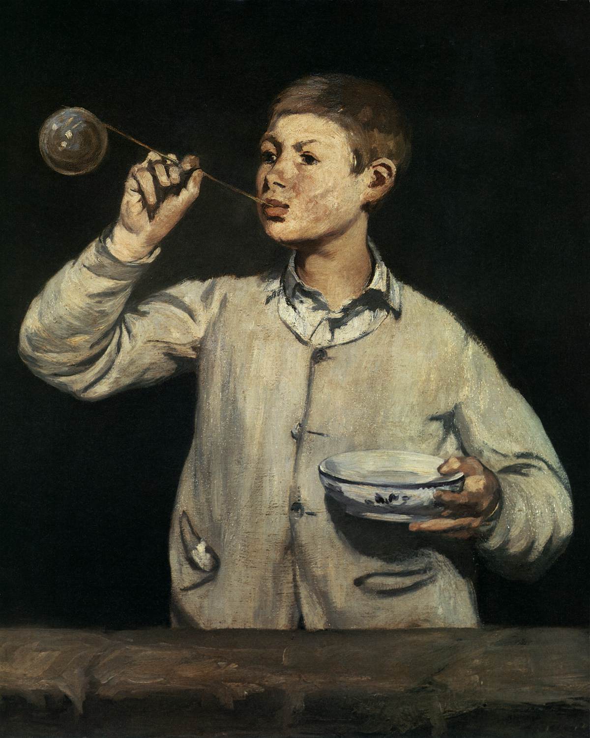 Boy Blowing Soap Bubbles